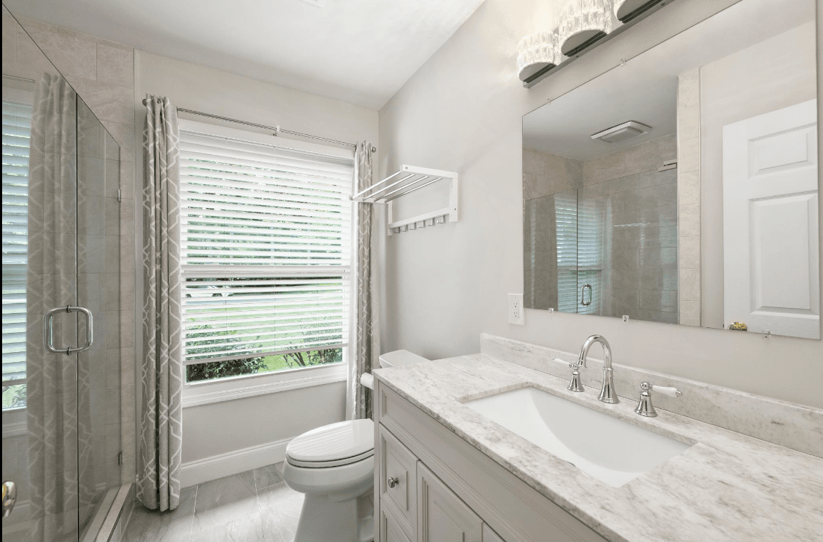 Modern bathroom renovation showcasing new tile and fixtures