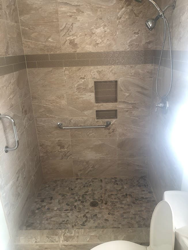 Completed bathroom renovation featuring contemporary styling