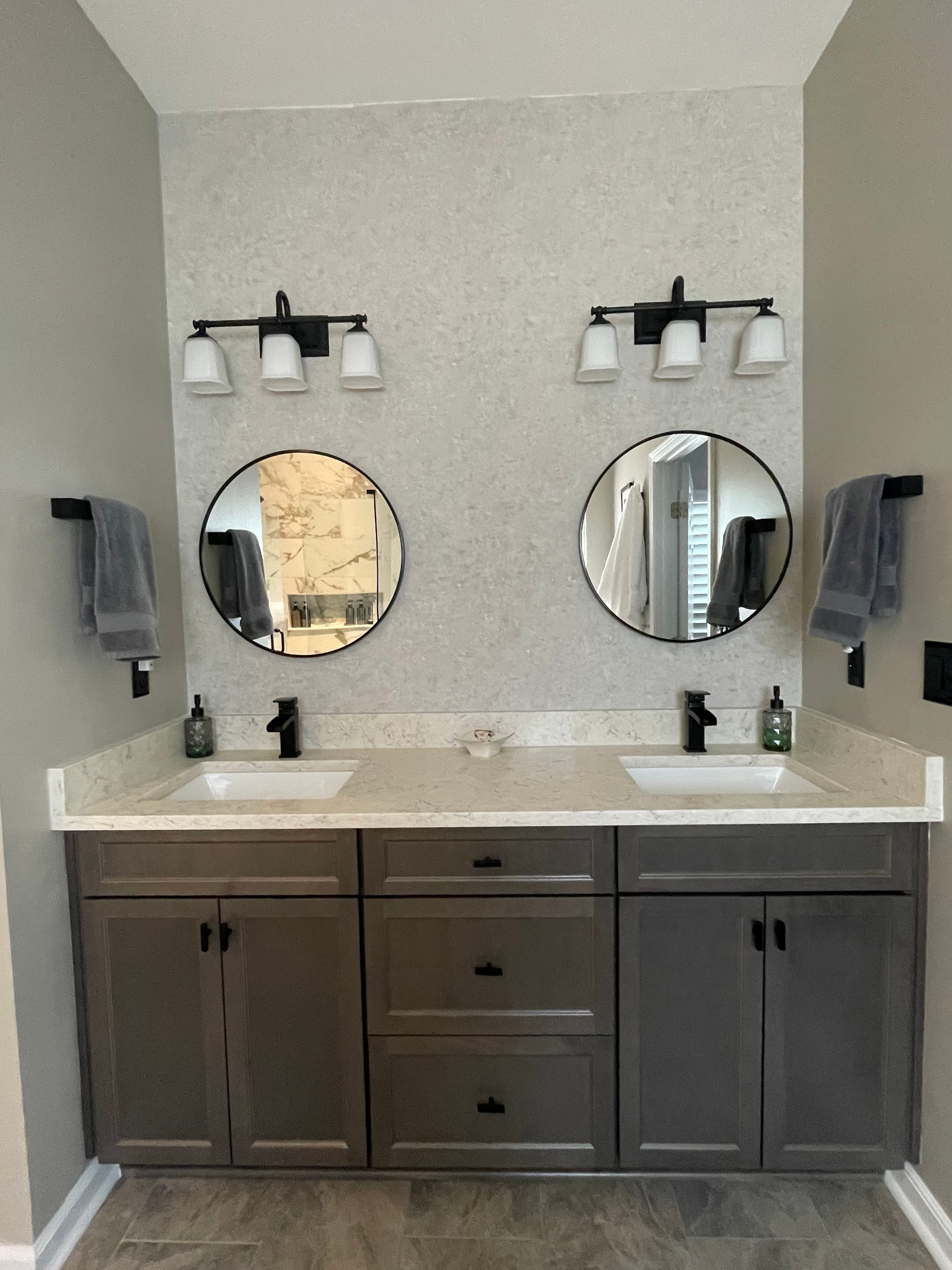 Bathroom renovation showcasing new tile work and updated amenities
