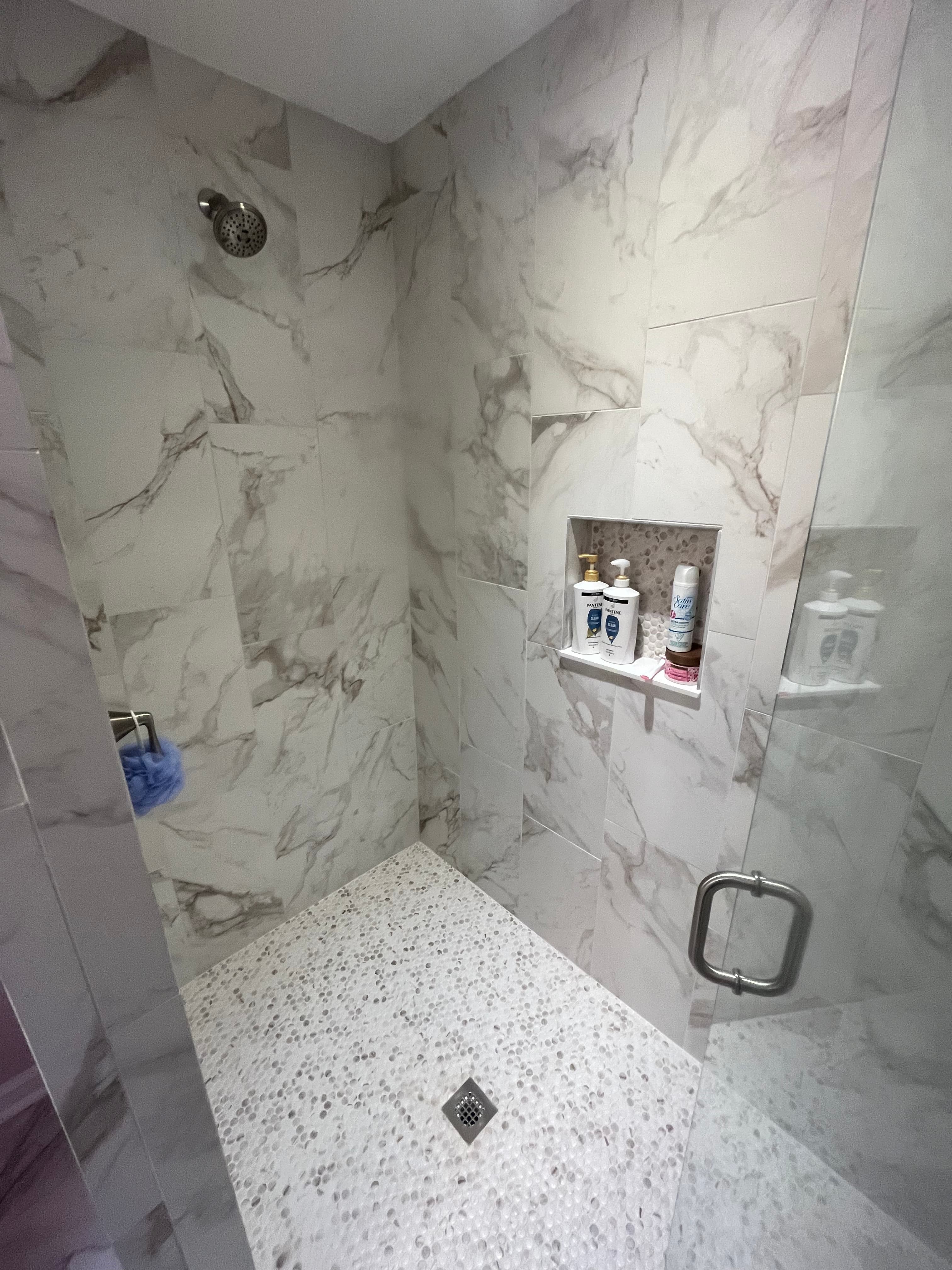 Bathroom renovation project X featuring completed renovation work